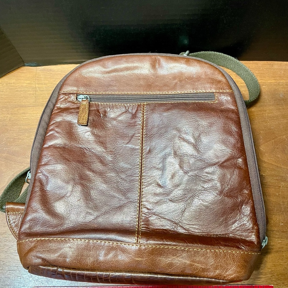 Jack George’s Elegant Chestnut Leather Backpack